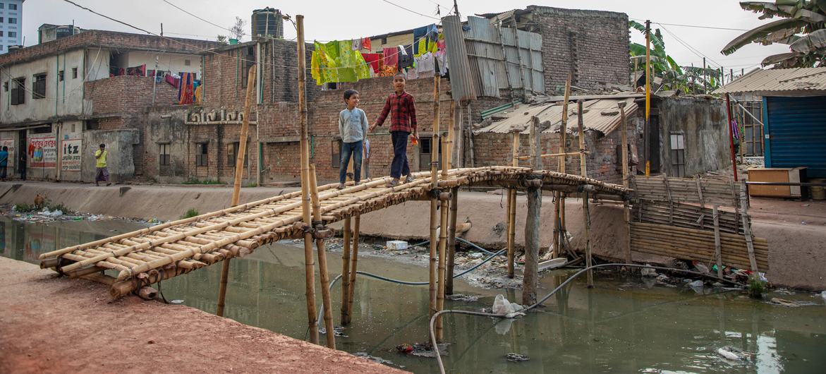 A polluted canal flows through a slum on the outskirts of Dhaka, the capital of Bangladesh. A polluted canal flows through a slum on the outskirts of Dhaka, the capital of Bangladesh.