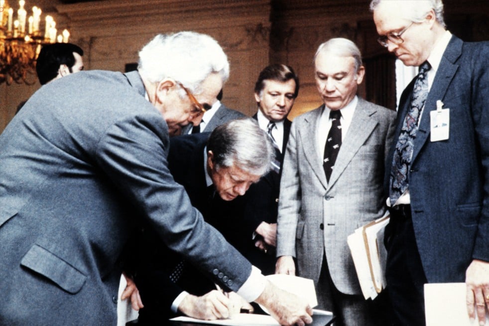 US President Jimmy Carter (2nd L) signs the order blocking Iranian funds in US banks, on November 14, 1979 in Washington DC (Source: AFP) US President Jimmy Carter (2nd L) signs the order blocking Iranian funds in US banks, on November 14, 1979 in Washington DC (Source: AFP)