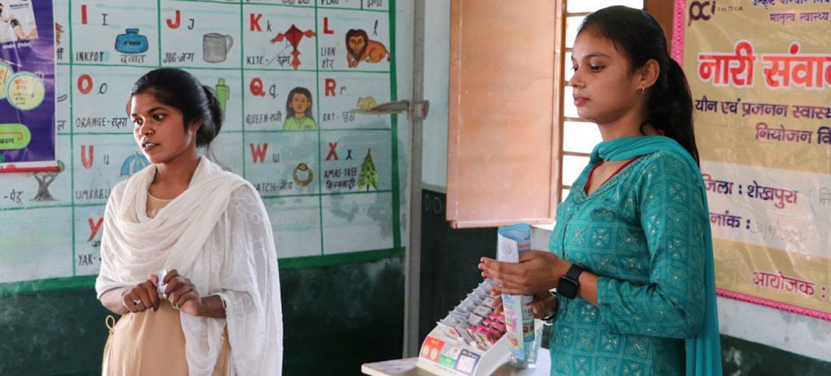 Two community workers provide information about contraceptives in Bihar, India.