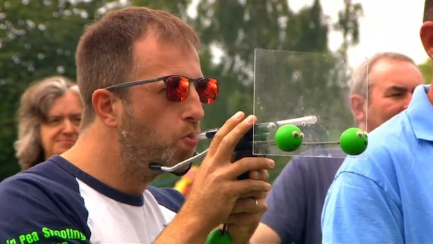 A Participant in the World Pea Shooting Championship 