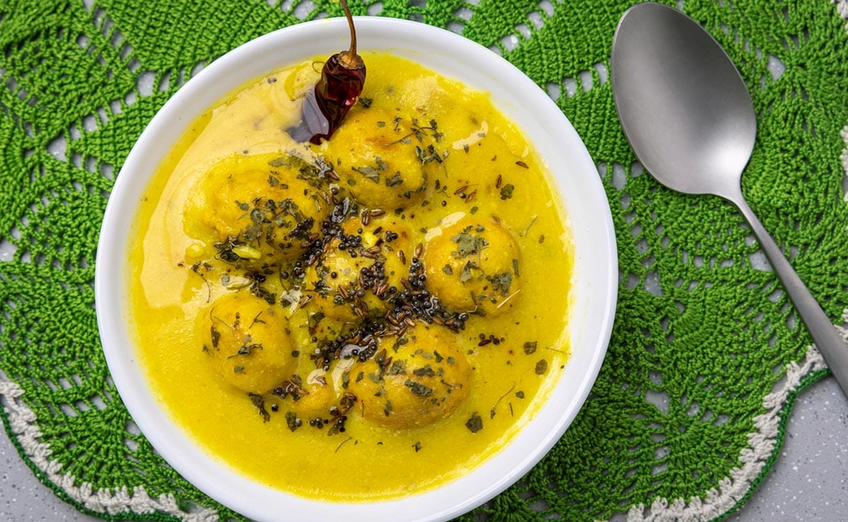 Kadhi Pakoda Recipe: Whole spices are used to flavour this Rajasthani kadhi Kadhi Pakoda Recipe: Whole spices are used to flavour this Rajasthani kadhi