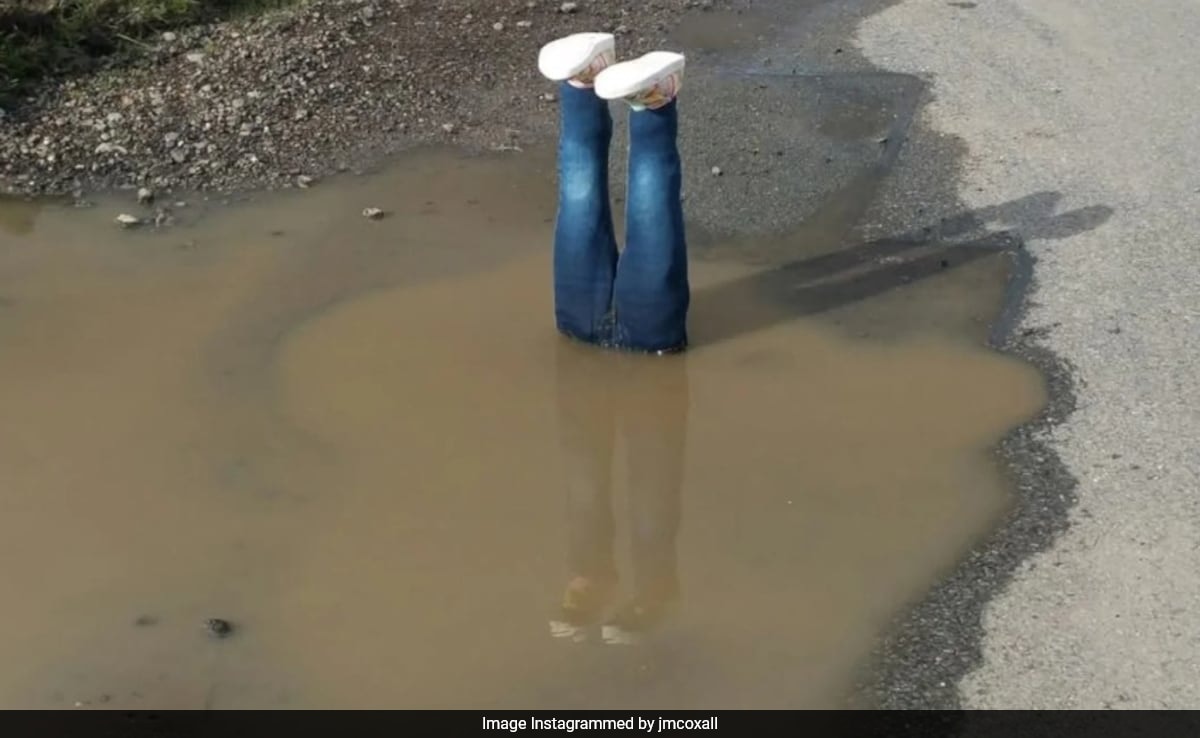 Frustrated By Potholes, UK Man Places Upside-Down Statue To Catch Officials' Attention