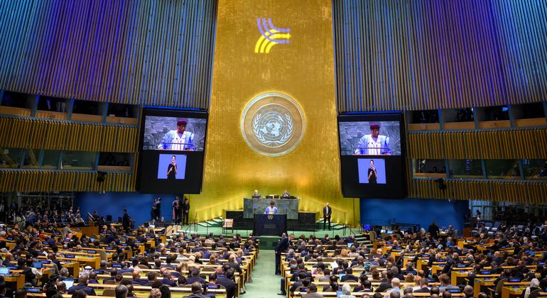 Philemon Yang (at podium and on screens), President of the seventy-ninth session of the United Nations General Assembly, addresses the opening of the Summit of the Future on 22 September 2024.