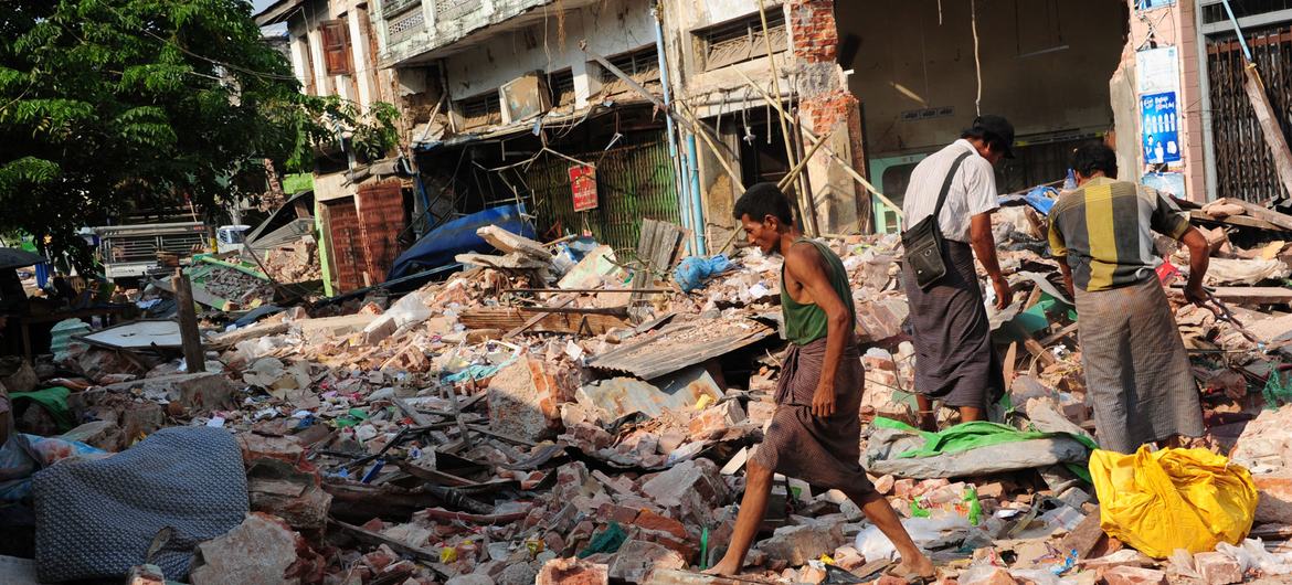 Earthquake survivors survey the ruins of their homes in Pyinmana, Myanmar following the earthquake there.