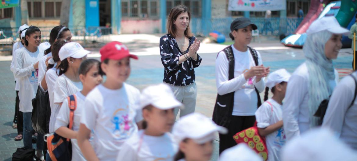 The author plays with students enjoying the "summer fun weeks" games in an UNRWA school in the Gaza Strip in 2023. (file) The author plays with students enjoying the "summer fun weeks" games in an UNRWA school in the Gaza Strip in 2023. (file)
