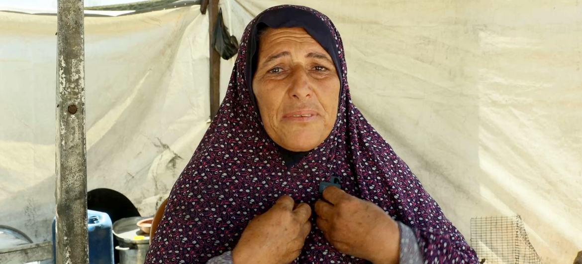 Badriya Barrawi, a displaced person in Gaza, is living among the ruins of destroyed buildings. Badriya Barrawi, a displaced person in Gaza, is living among the ruins of destroyed buildings.