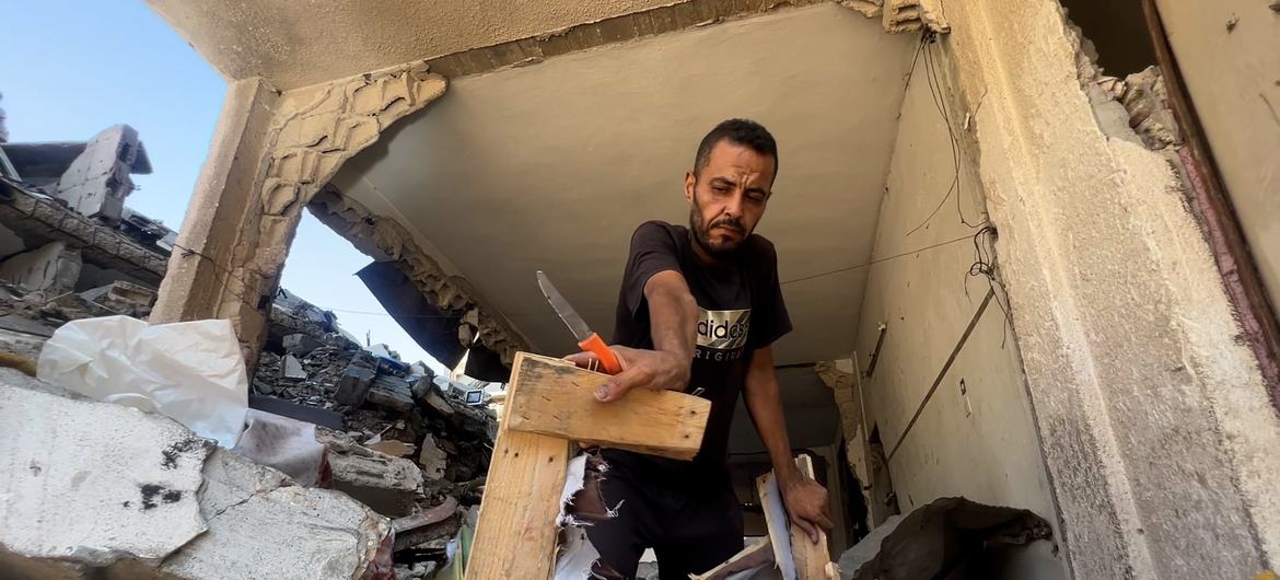 Hossam Madi, a resident of Sheikh Radwan in northern Gaza City removes some of his belongings from his destroyed home. Hossam Madi, a resident of Sheikh Radwan in northern Gaza City removes some of his belongings from his destroyed home.