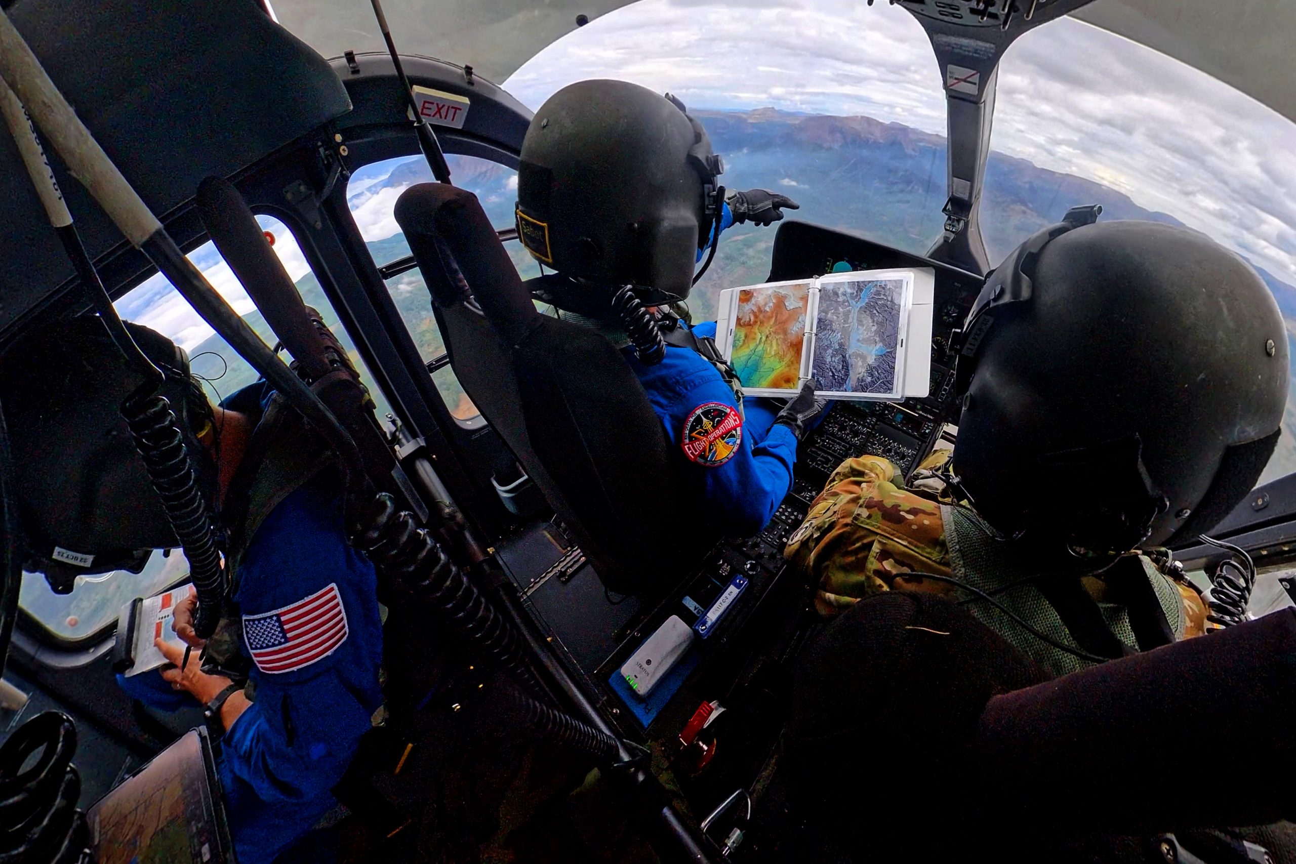 NASA astronauts Matthew Dominick (left) and Mark Vande Hei (right) prepare to fly out to a landing zone in the Rocky Mountains as part of the certification run for the NASA Artemis course at the High-Altitude Army National Guard Aviation Training Site in Gypsum, Colorado, Aug. 26.