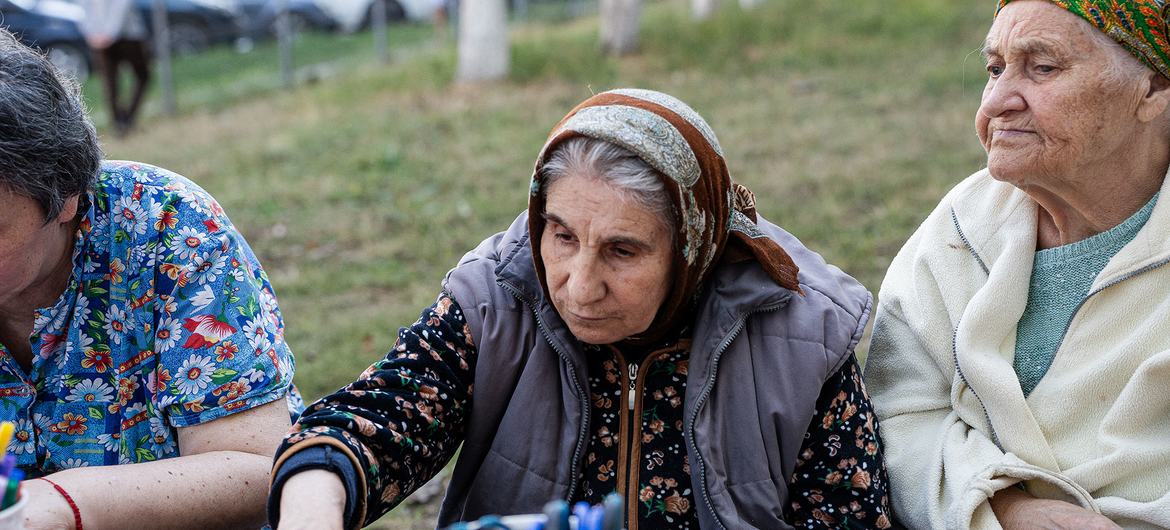 Ana (centre) sits alongside other elderly women who have sought support at the centre in Chișinău. Ana (centre) sits alongside other elderly women who have sought support at the centre in Chișinău.