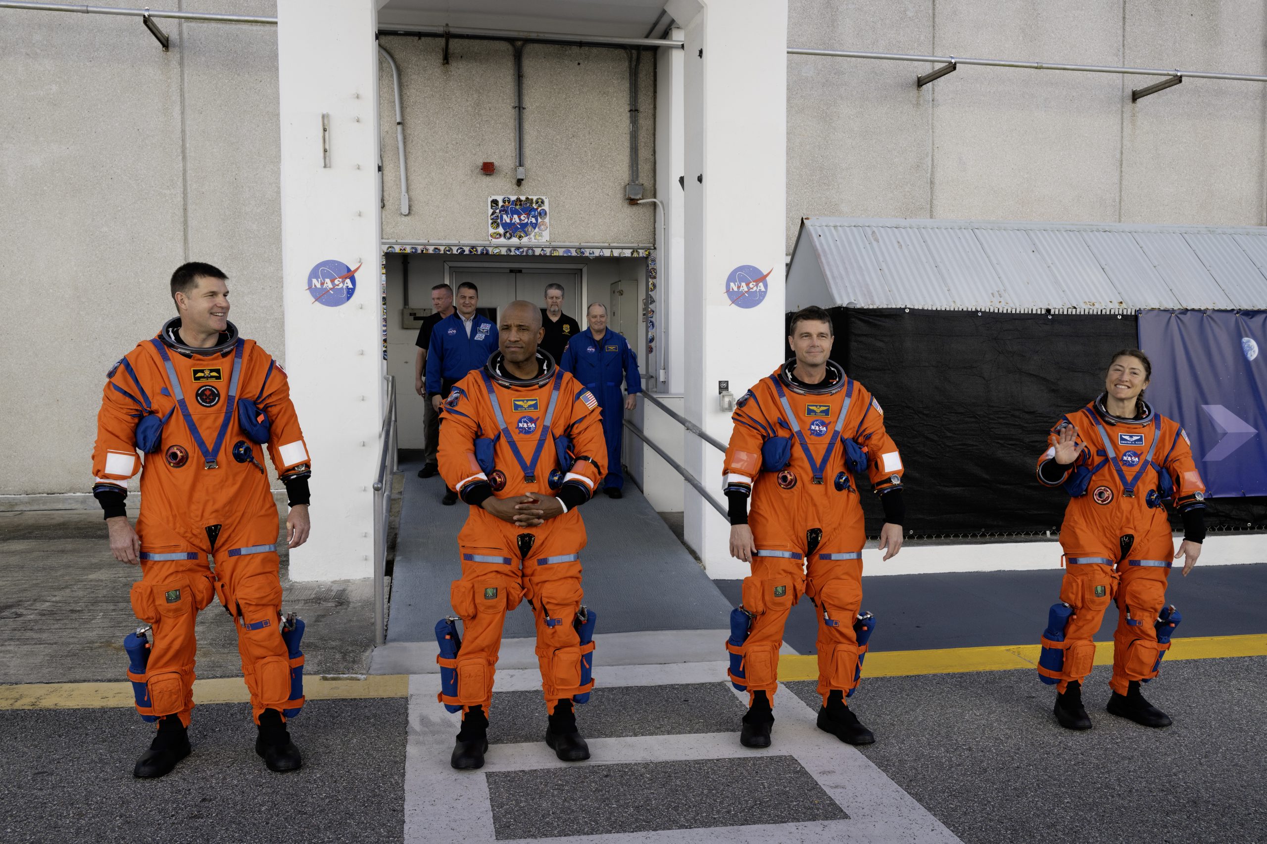 Crew depart the Neil A. Armstrong Operations and Checkout Building to travel to the Vehicle Assembly Building to board their Orion spacecraft atop NASA’s SLS (Space Launch System) rocket as part of the Artemis II Countdown Demonstration Test, December 20, 2025