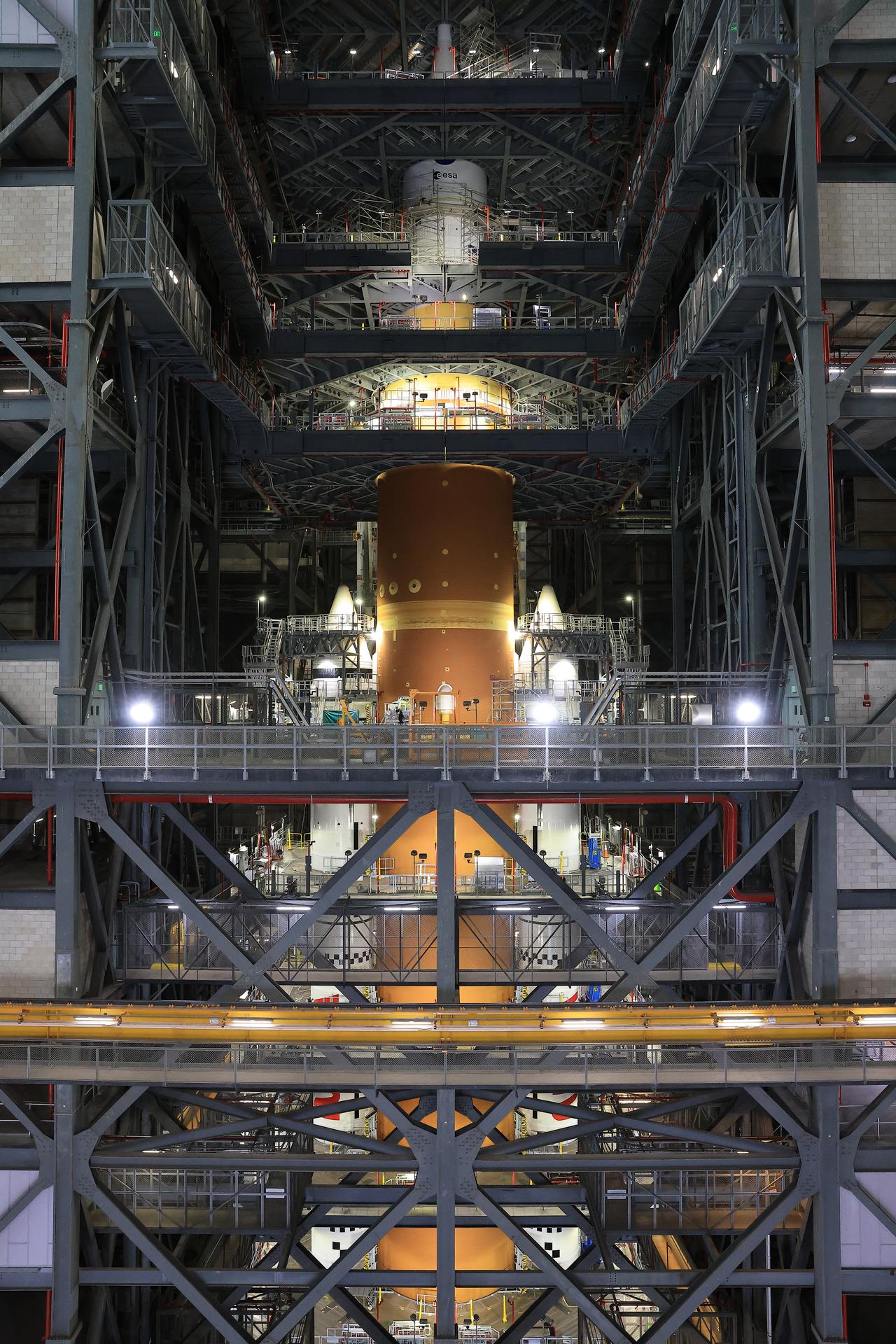 NASA’s Artemis II Orion spacecraft with its launch abort system is stacked atop the agency’s SLS (Space Launch System) rocket in High Bay 3 of the Vehicle Assembly Building at NASA’s Kennedy Space Center in Florida on Monday, Oct. 20, 2025. The spacecraft will carry NASA astronauts Reid Wiseman, Victor Glover, Christina Koch, and CSA (Canadian Space Agency) astronaut Jeremy Hansen on a 10-day mission around the Moon and back in early 2026. Teams will begin conducting a series of verification tests ahead of rolling out the integrated SLS rocket to NASA Kennedy’s Launch Complex 39B for the wet dress rehearsal. 