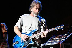 Weir playing guitar