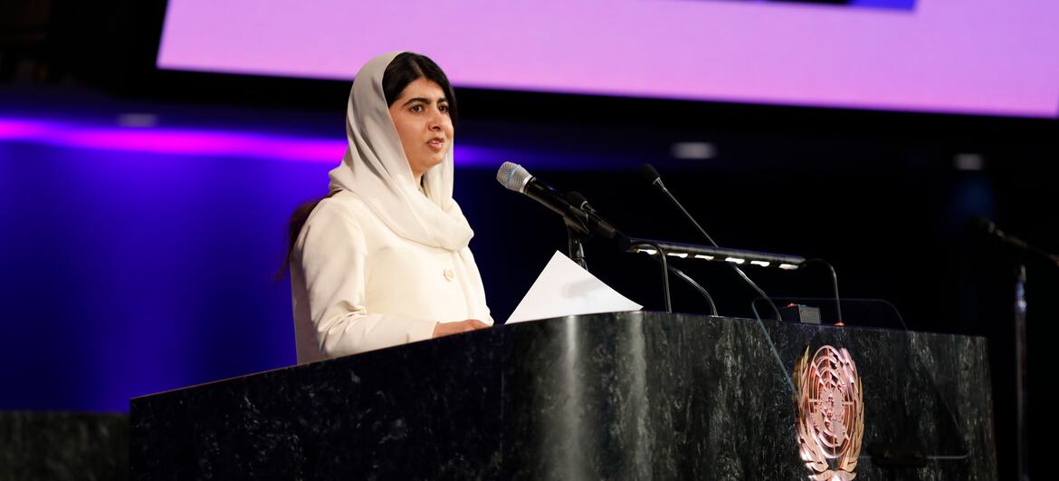 Malala Yousafzai speaking at a podium with the UN emblem during the International Women's Day 2026 observance at UN Headquarters.