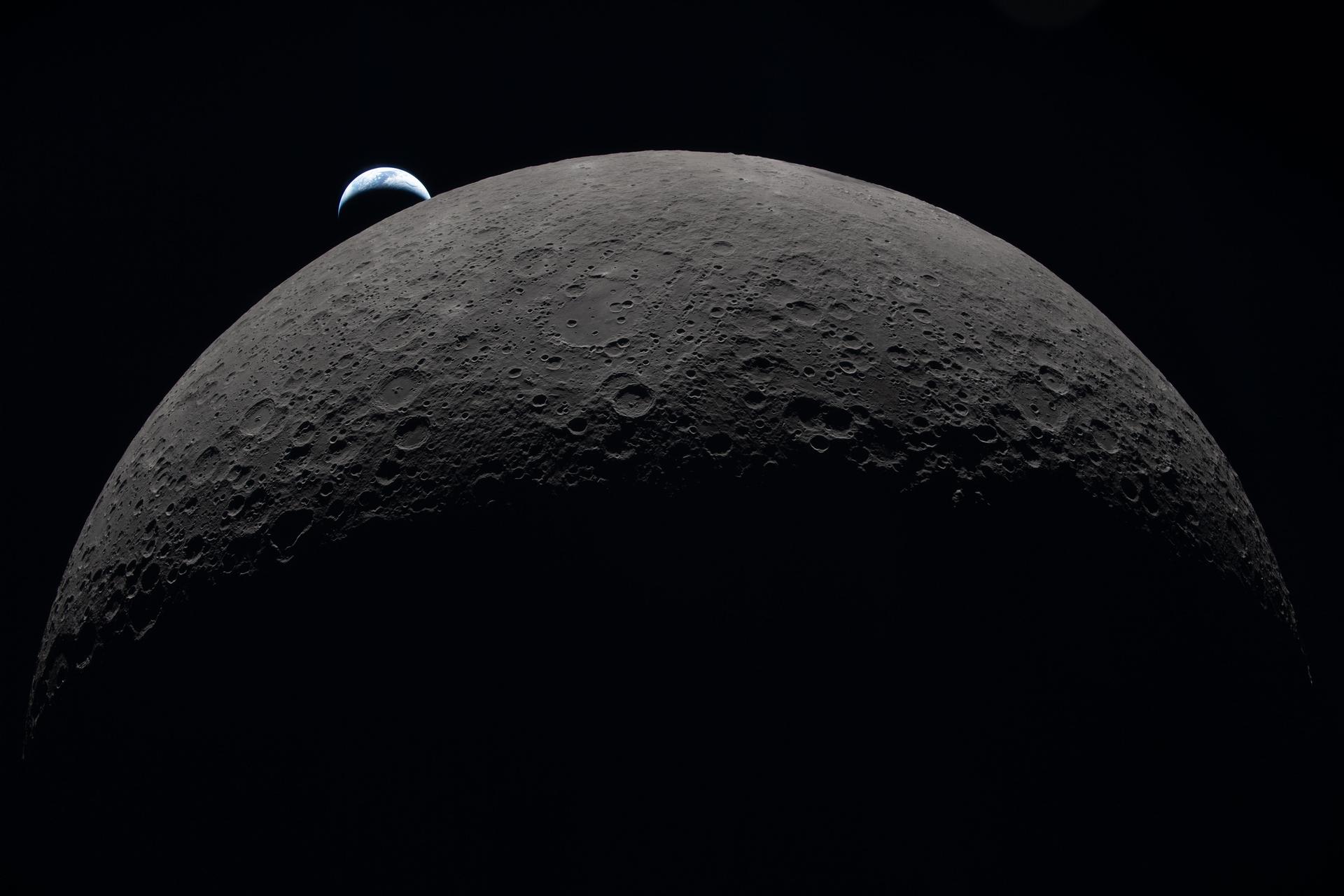 Picture from Artemis II, Earth in the distance behind the moon.